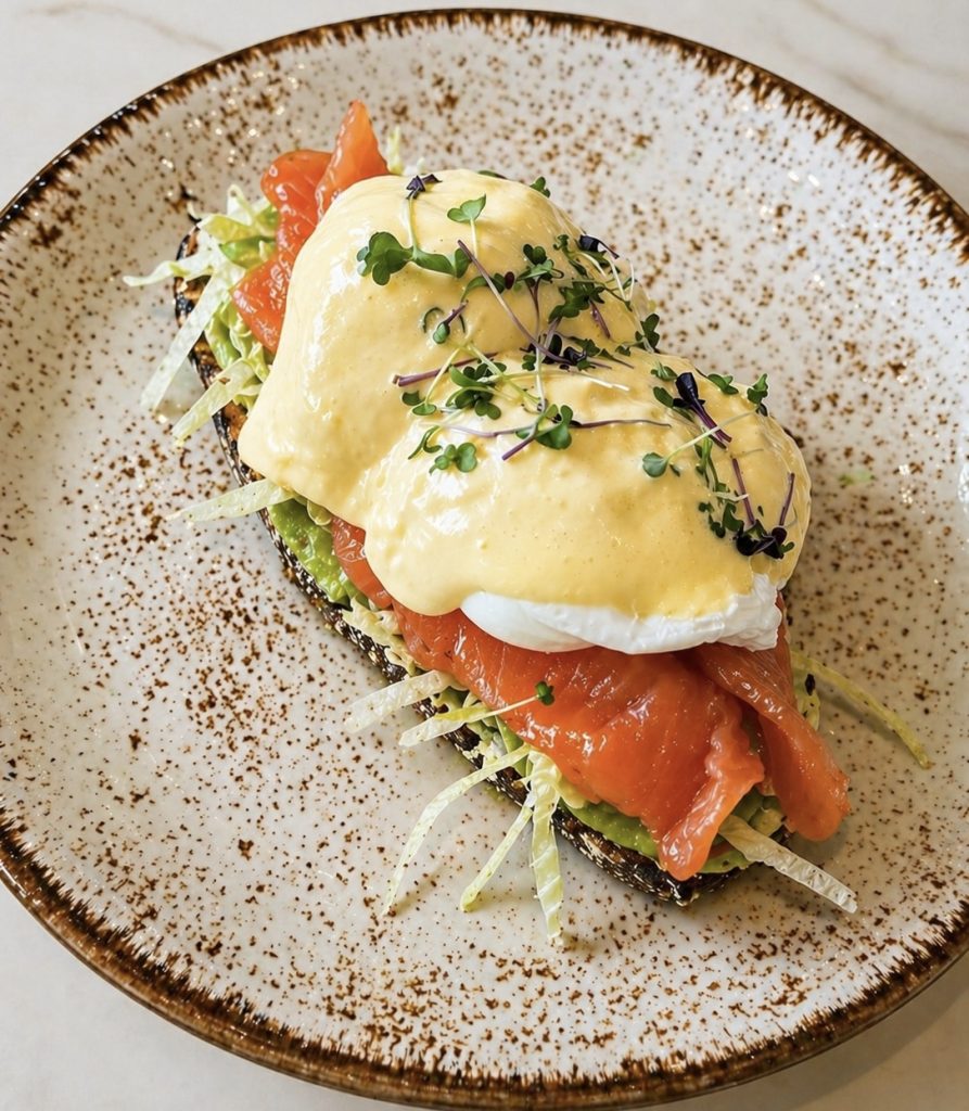 Toast with Eggs Benedict, Avocado Guacamole & Salmon.